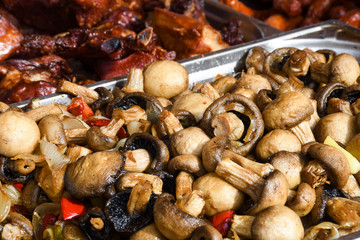 Sauteed mushrooms with garlic and parsley served during catering event.