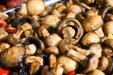 Sauteed mushrooms with garlic and parsley served during catering event.