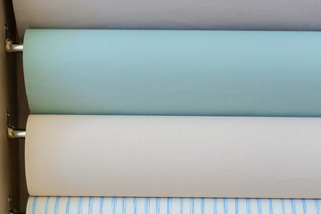 Obraz premium Trendy multicolored modern design rolls Wallpaper as background. Luxury wallpapers for interiors.