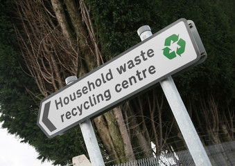 A sign showing a Household waste recycling centre
