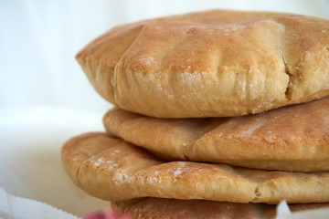 A stack of pita bread on a white background - fresh baked gluten-free pita bread 