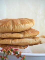 A stack of pita bread on a white background - fresh baked gluten-free pita bread 