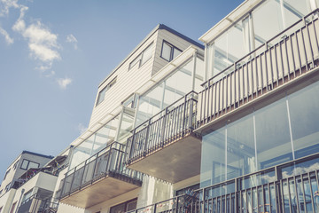 Fototapeta premium Modern Luxury Scandinavia Apartment Building Blue Sky Facade Home Residential Structure. Vintage style