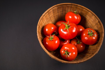 Cherry tomatoes in a wooden basket
