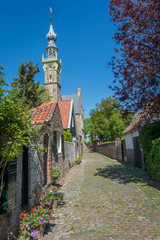 Fototapeta na wymiar Picturesque street with a town hall in Veere, popular holiday destination located in the Province of Zeeland, The Netherlands