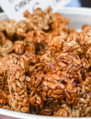 Granola bar in a bowl for sale. Healthy sweet dessert snack. Cereal granola bar with nuts