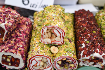 Various types or many colorful assortment of Turkish delights rolls for sale in a shop in Istanbul