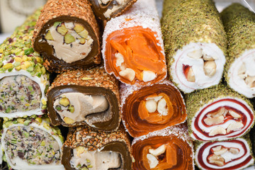 Various types or many colorful assortment of Turkish delights rolls for sale in a shop in Istanbul