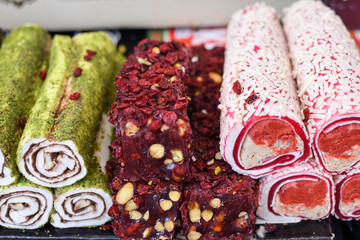 Various types or many colorful assortment of Turkish delights rolls for sale in a shop in Istanbul