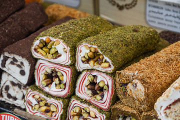 Various types or many colorful assortment of Turkish delights rolls for sale in a shop in Istanbul