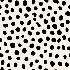 Vector texture with random spots. Seamless dotted pattern.