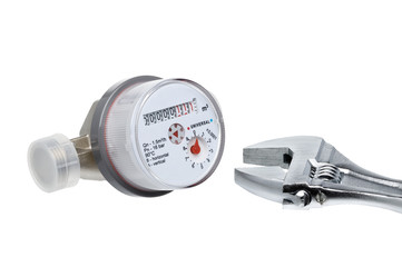 New water meter and wrench isolated on white background.
