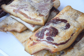 Romanian traditional salty pork belly specialty named slanina, on counter
