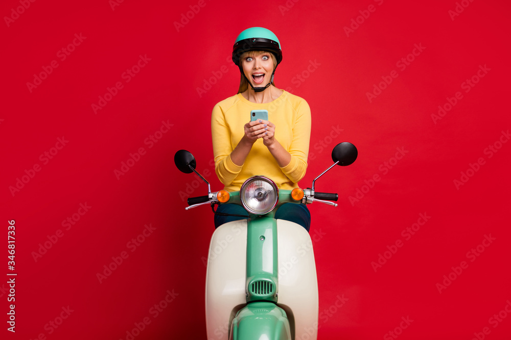 Sticker Portrait of her she nice attractive lovely pretty excited cheerful cheery girl sitting on moped using cell internet online fast connection isolated on bright vivid shine vibrant red color background