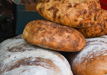 Homemade traditional buns of bread, authentic rustic recipe on counter top during food festival