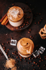 Still life of creamy corean dalgona coffee with coffee beans