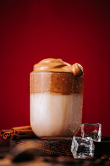 Still life of creamy corean dalgona coffee with coffee beans