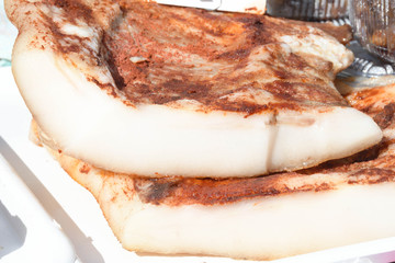 Romanian traditional salty pork belly specialty named slanina, on counter