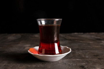Turkish tea cup with black tea. Pear glass