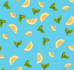 Lemon slices and mint leaves pattern on blue background.