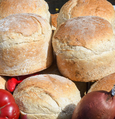 Homemade traditional buns of bread, authentic rustic recipe on counter top during food festival