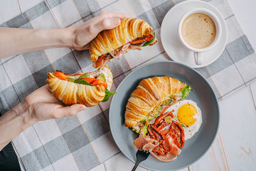 The concept of a hearty and tasty breakfast of fresh classic croissants with a variety of toppings...