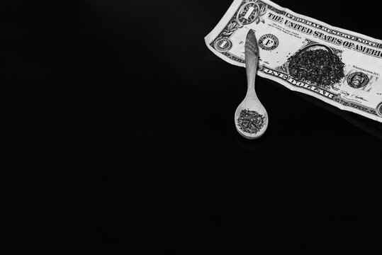 Snus - grated moistened powder and chewing tobacco in a wooden spoon.