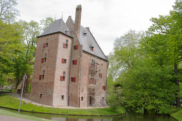An ancient castle called Kinkelburg with scaffolding for restore works in Bemmel, Netherlands
