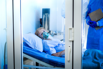 The patients were quarantined in the quarantine room looking out. To prevent the infection from coronavirus COVID19 spreading.