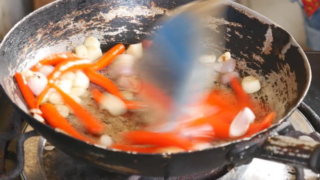 Stir-frying chili and garlic in the pan to prepare for cooking, Thai food that consists primarily of spicy