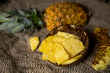 pineapple on the wooden texture background. Pineapple slices with leaves. Pineapple isolate. 