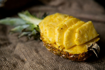 pineapple on the wooden texture background. Pineapple slices with leaves. Pineapple isolate. 