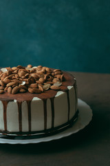 Cake with chocolate glaze and almonds