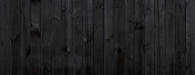 Black wood texture background coming from natural tree. Old wooden panels that are empty and beautiful patterns.