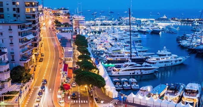 Monaco, Monte-Carlo 30.09.2017: Time-lapse of movement of boats in port, boat yacht show, event is over, the richest people from around the world, cityscape, tenders, mega yacht, night lights