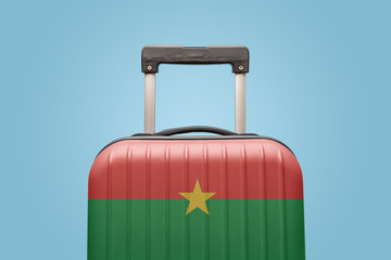 Baggage with Burkina Faso flag print tourism and vacation concept.