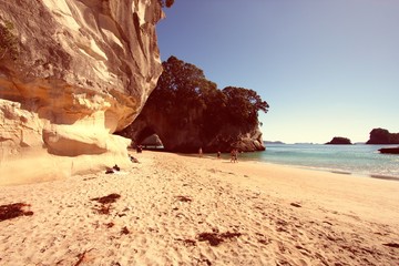 Cathedral Cove, New Zealand. Vintage filtered colors style.