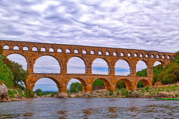 The world famous Pont du Gard, an aqueduct from the time of the Romans, historical building in the...