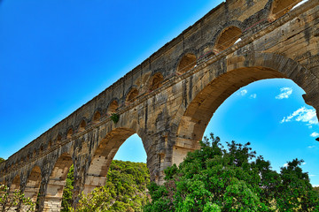 The world famous Pont du Gard, an aqueduct from the time of the Romans, historical building in the...