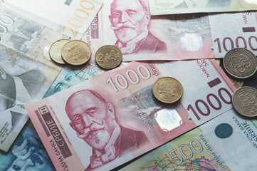 Serbian money dinar, pile of coins on wooden table