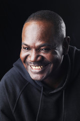 Smiling portrait of a black man.