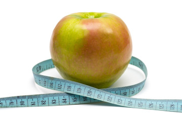 apple with old blue measuring tape on a white background