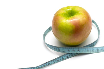 apple with old blue measuring tape on a white background
