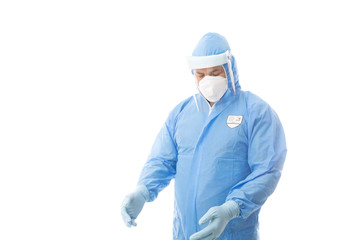 Worker wearing a hasmat coverall, maskgloves  and face shield