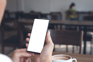 Mockup of man using smartphone in cafe