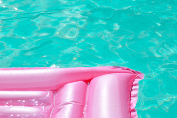 Pink float in the pool in summer
