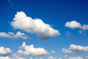 Naklejka na ściany i meble Blue sky with big clouds. Nature background.