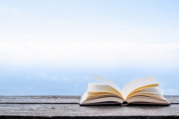 The Bible placed on the table was opened for learning to understand the Bible in order to pray to God and to ask God to protect himself and his family. The concept of Bible learning and faith in God