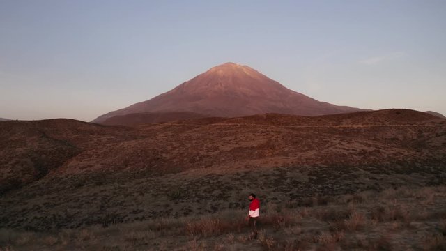 Drone shot of a Guy walking by in the Misti Volcano 
