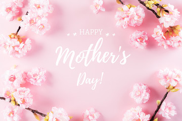 Happy Mother's Day, Women's Day or Valentine's Day greeting concept. Pastel Pink Colours Background with  blossom flowers flat lay patterns.